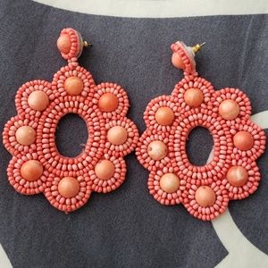 Beaded earrings in coral
